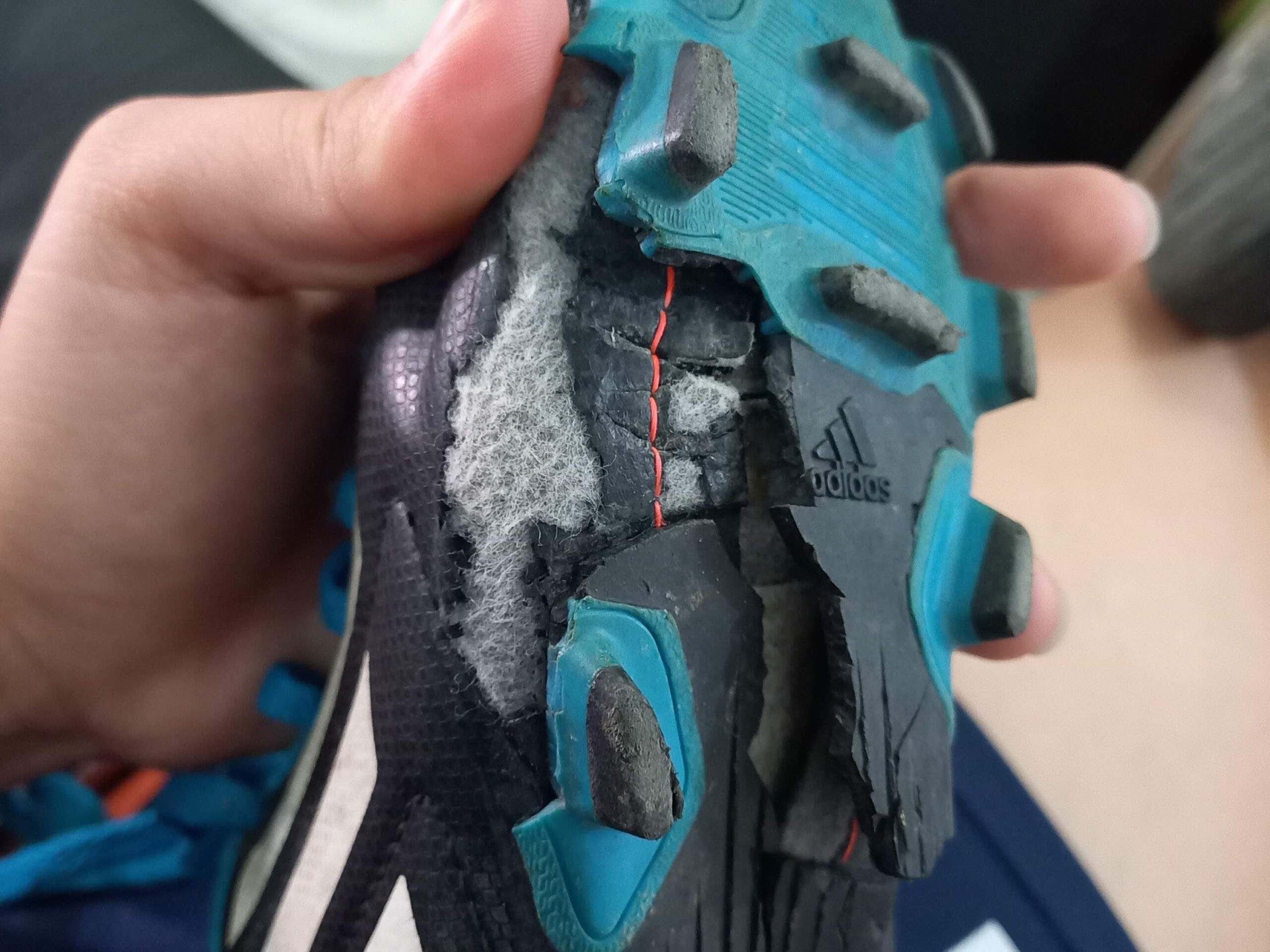 Youth receiving donated soccer cleats